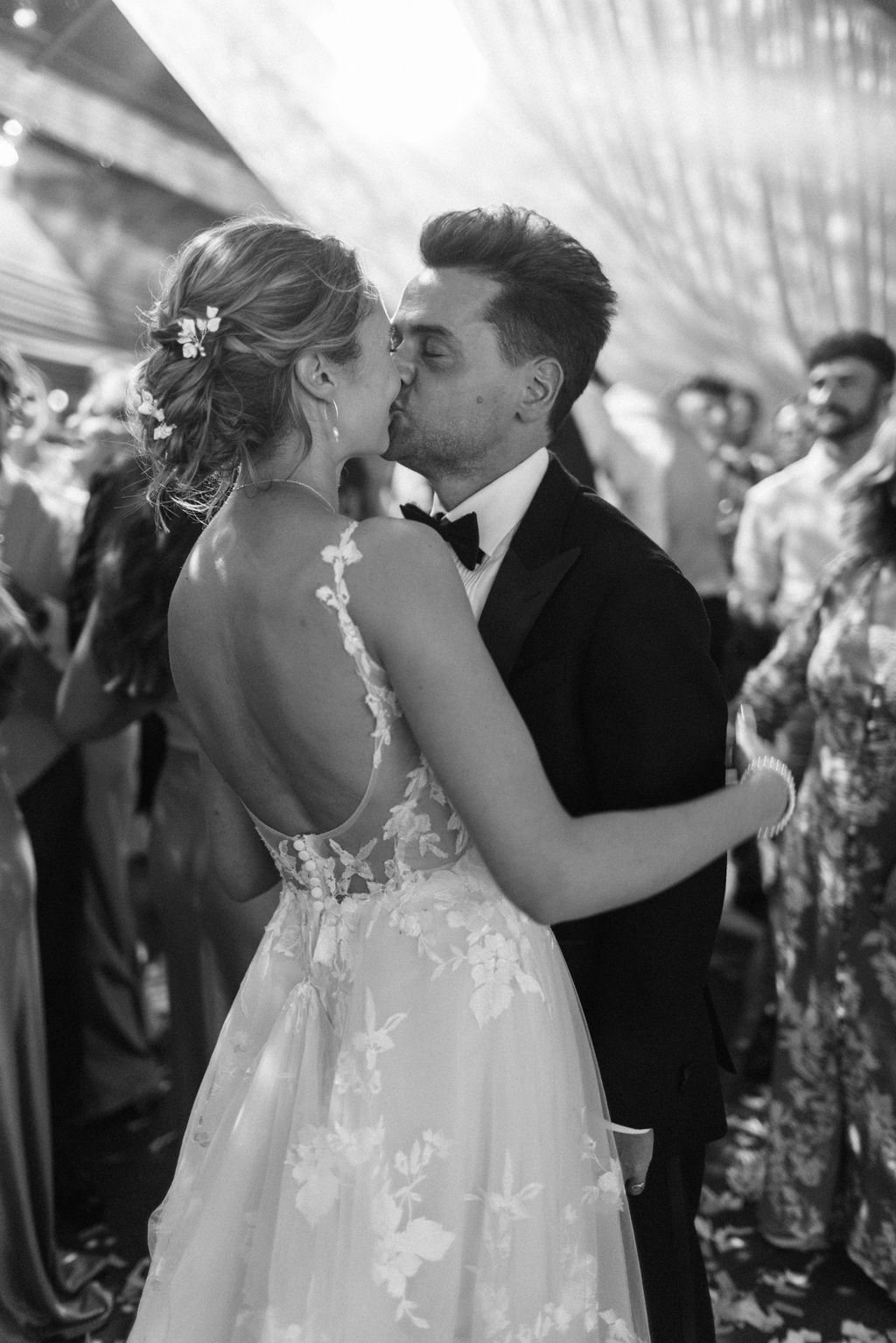 Bride and groom kissing on dance floor