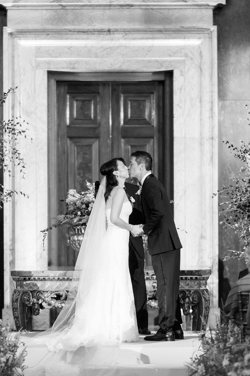 bride and groom's first kiss at Blenheim Palace wedding