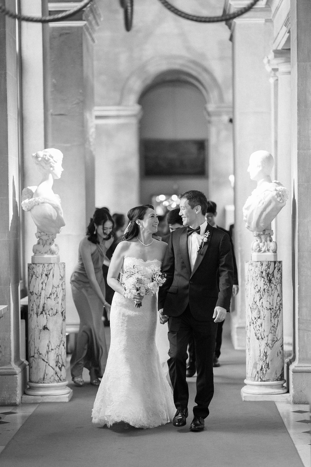 bride and groom walking the corridors of Blenheim Palace