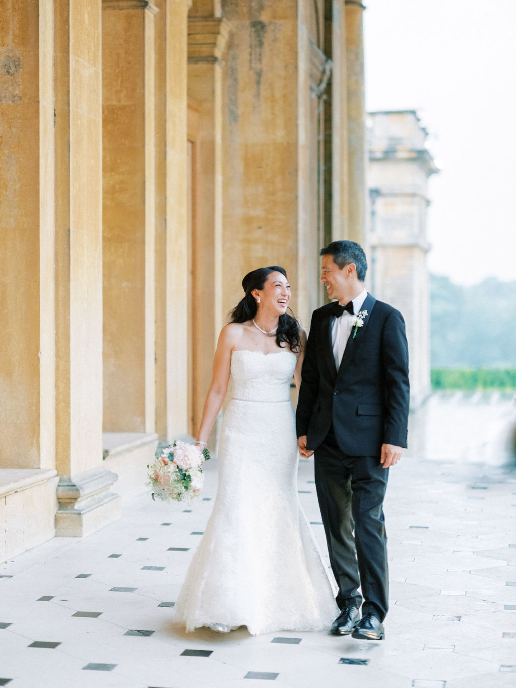 bride and groom in the balustrades at Blenheim Palace