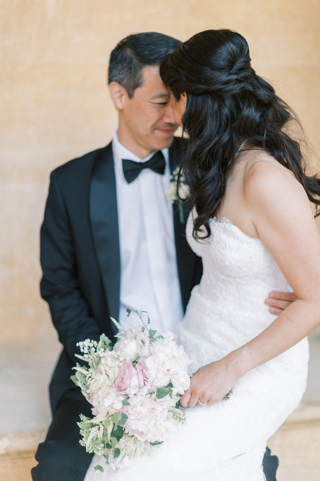 bride and groom cuddling