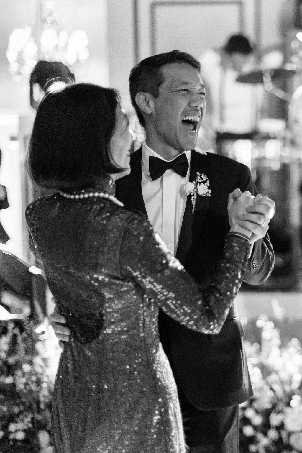 groom dancing with mother at Blenheim Palace wedding