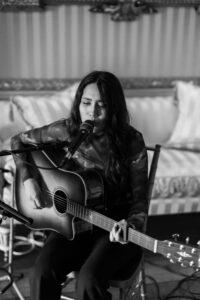Singer during wedding ceremony at Goodwood House Summer Wedding