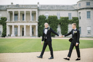 Two grooms at Goodwood House wedding